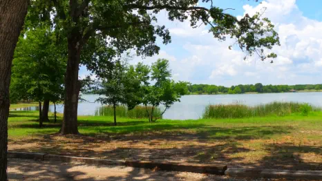 A scenic view of our fishing lodge by the lake.