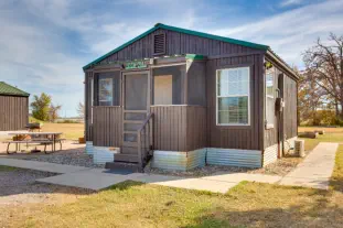 Scenic view of waterfront cabins surrounded by nature.